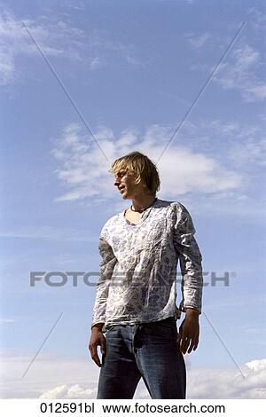 portrait of young male looking into the distance View Large Photo Image Stock Image - portrait of young male looking into the distance. Fotosearch