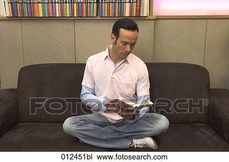 portrait of young man reading book in cafe View Large Photo Image Stock Image - portrait of young man reading book in cafe. Fotosearch
