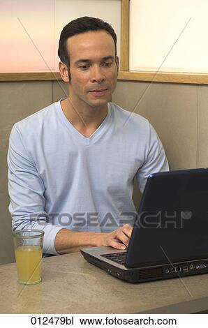 portrait of young man with thoughtful expression typing on notebook View Large Photo Image Stock Image - portrait of young man with thoughtful expression typing on notebook. Fotosearch