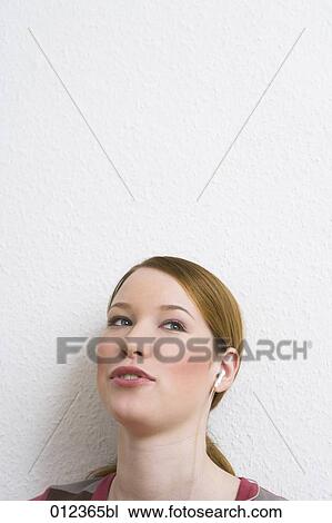 portrait of young woman wearing headphones View Large Photo Image Stock Image - portrait of young woman wearing headphones. Fotosearch