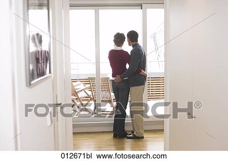 rear view of couple looking out of the window View Large Photo Image Stock Image - rear view of couple looking out of the window. Fotosearch