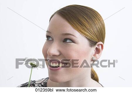 red haired teenager with flower View Large Photo Image Stock Image - red haired teenager with flower. Fotosearch