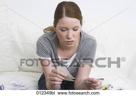 sad looking teenage girl ripping up photographs View Large Photo Image Stock Image - sad looking teenage girl ripping up photographs. Fotosearch