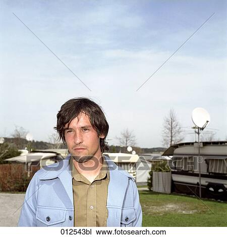 serious looking young man on campsite View Large Photo Image Stock Image - serious looking young man on campsite. Fotosearch