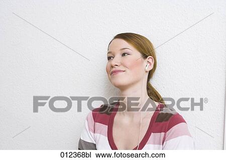 smiling young woman with headphones View Large Photo Image Stock Image - smiling young woman with headphones. Fotosearch