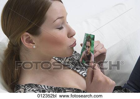 teenage girl about to kiss picture of boyfriend View Large Photo Image Stock Image - teenage girl about to kiss picture of boyfriend. Fotosearch
