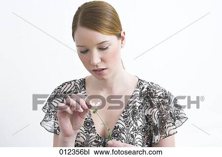 teenage girl plucking petals of flower View Large Photo Image Stock Image - teenage girl plucking petals of flower. Fotosearch