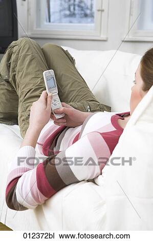 teenage girl writing text message on her mobile phone View Large Photo Image Stock Image - teenage girl writing text message on her mobile phone. Fotosearch