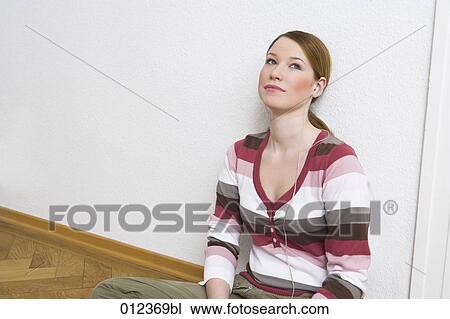 thoughtful looking teenage girl with headphones View Large Photo Image Stock Image - thoughtful looking teenage girl with headphones. Fotosearch