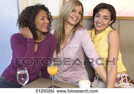 three young females posing for a portrait in bar View Large Photo Image Stock Image - three young females posing for a portrait in bar. Fotosearch