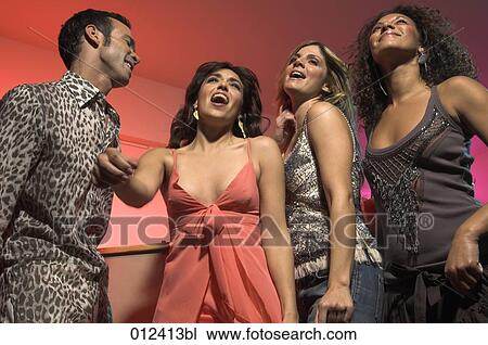 three young women and their male friend partying at a bar View Large Photo Image Stock Image - three young women and their male friend partying at a bar. Fotosearch