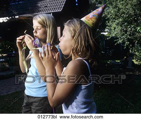 two girls doing preparations for garden party blowing streamers View Large Photo Image Stock Image - two girls doing preparations for garden party blowing streamers. Fotosearch