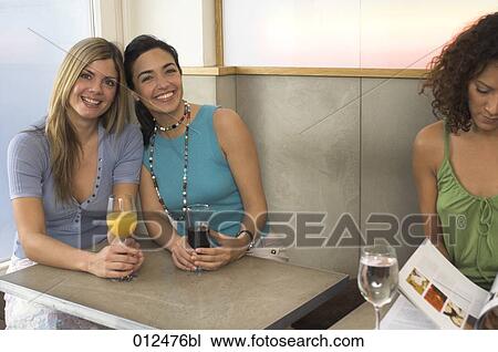 two women friends smiling radiantly in bar View Large Photo Image Stock Image - two women friends smiling radiantly in bar. Fotosearch