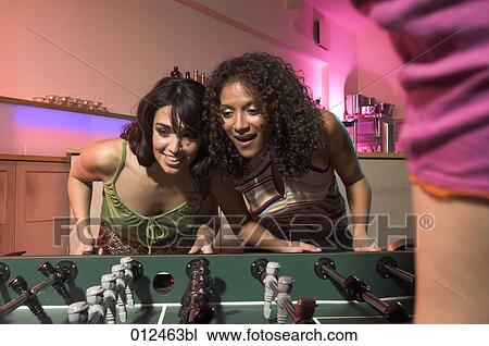 two young females playing tabletop soccer View Large Photo Image Stock Image - two young females playing tabletop soccer. Fotosearch