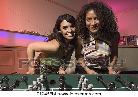 two young women having fun with tabletop football in bar View Large Photo Image Stock Image - two young women having fun with tabletop football in bar. Fotosearch