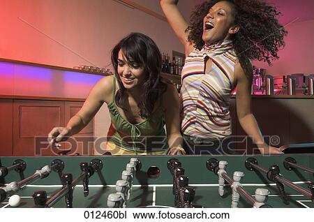 woman making a joyful jump in tabletop football match View Large Photo Image Stock Image - woman making a joyful jump in tabletop football match . Fotosearch