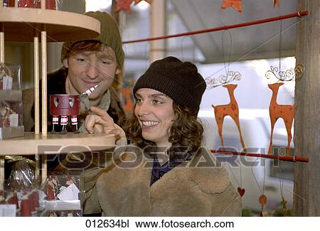 young couple buying christmas decorations View Large Photo Image Stock Image - young couple buying christmas decorations. Fotosearch