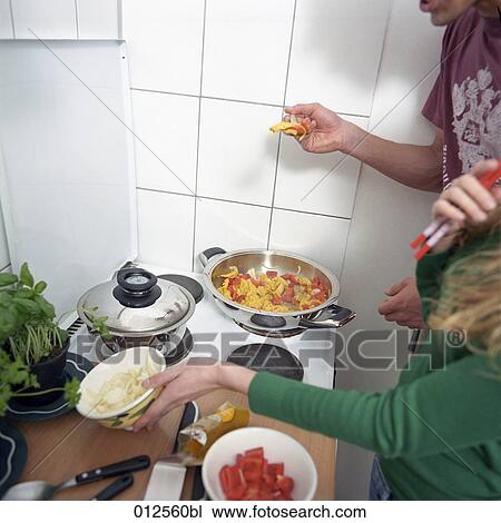 young couple cooking together View Large Photo Image Stock Image - young couple cooking together. Fotosearch