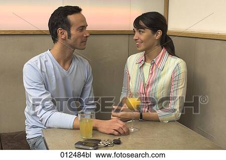 young couple having a conversation in restaurant View Large Photo Image Stock Image - young couple having a conversation in restaurant. Fotosearch
