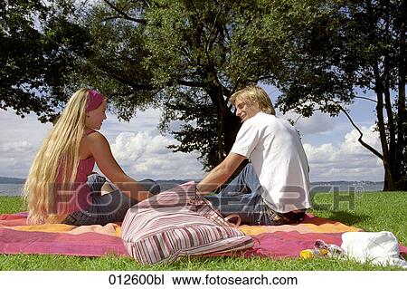 young couple having picnic near lake View Large Photo Image Stock Image - young couple having picnic near lake. Fotosearch