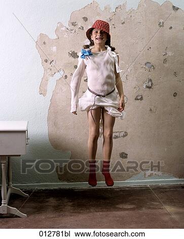 young girl jumping for joy in empty room View Large Photo Image Stock Image - young girl jumping for joy in empty room. Fotosearch