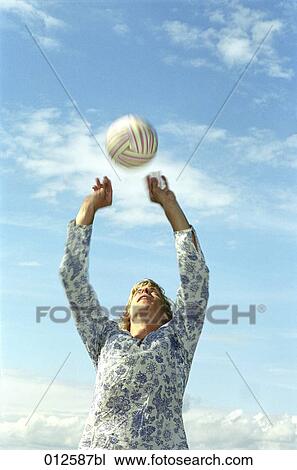 young man trying to catch volleyball View Large Photo Image Stock Image - young man trying to catch volleyball. Fotosearch