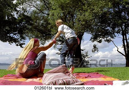 young man trying to run with his girlfriend towards lake View Large Photo Image Stock Image - young man trying to run with his girlfriend towards lake. Fotosearch