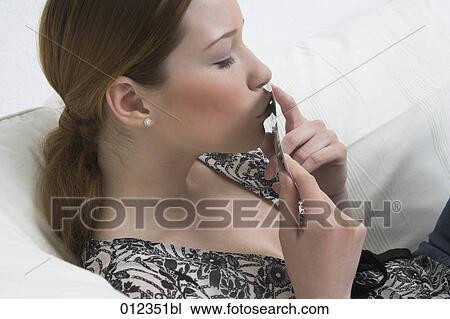 young woman kissing photograph View Large Photo Image Stock Image - young woman kissing photograph. Fotosearch