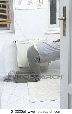 young woman leaning over toilet vomiting View Large Photo Image Stock Image - young woman leaning over toilet vomiting. Fotosearch