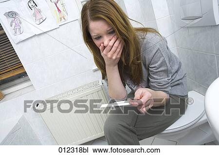 young woman with pregnancy test looking horrified View Large Photo Image Stock Image - young woman with pregnancy test looking horrified. Fotosearch
