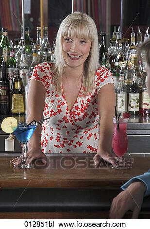 barmaid serving cocktails at bar View Large Photo Image Stock Image - barmaid serving cocktails at bar. Fotosearch