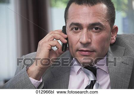 businessman talking on his cellphone View Large Photo Image Stock Image - businessman talking on his cellphone. Fotosearch