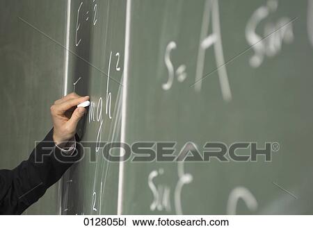 close-up of hand writing formula on blackboard View Large Photo Image Stock Image - close-up of hand writing formula on blackboard. Fotosearch