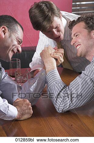 group of friends arm wrestling in bar View Large Photo Image Stock Image - group of friends arm wrestling in bar. Fotosearch