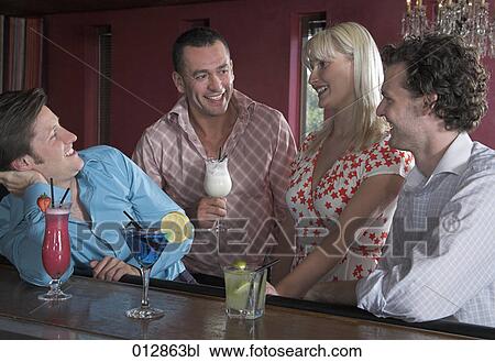 group of good friends sharing a smile at bar View Large Photo Image Stock Image - group of good friends sharing a smile at bar. Fotosearch