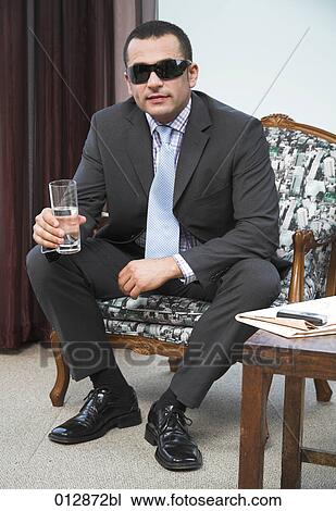 portrait of man wearing suit and sunglasses View Large Photo Image Stock Image - portrait of man wearing suit and sunglasses. Fotosearch