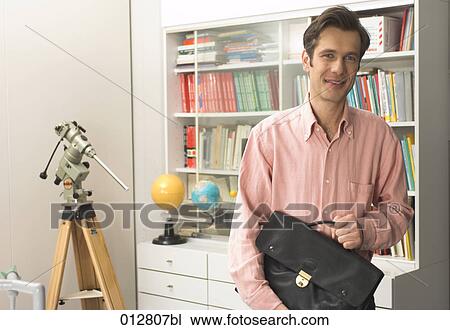 Stock Image - portrait of scientist with briefcase . Fotosearch