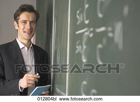 portrait of smiling scientist with formula written on blackboard View Large Photo Image Stock Image - portrait of smiling scientist with formula written on blackboard. Fotosearch