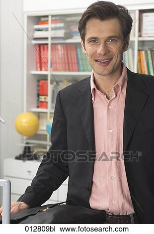 portrait of smiling teacher with briefcase View Large Photo Image Stock Image - portrait of smiling teacher with briefcase. Fotosearch