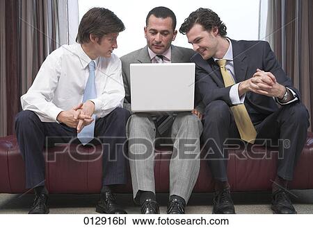 portrait of three businessmen sharing a laptop View Large Photo Image Stock Image - portrait of three businessmen sharing a laptop. Fotosearch