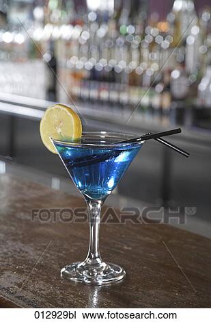 still life of blue cocktail with straw and piece of lemon View Large Photo Image Stock Image - still life of blue cocktail with straw and piece of lemon . Fotosearch