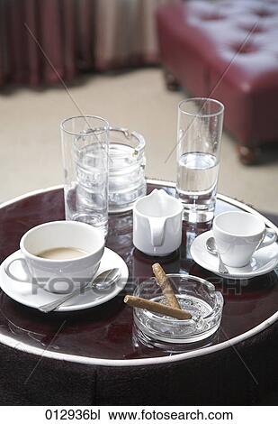still life of cups, glasses and small cigars on tray View Large Photo Image Stock Image - still life of cups, glasses and small cigars on tray. Fotosearch