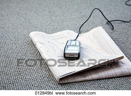 still life of mobile phone lying on business paper View Large Photo Image Stock Image - still life of mobile phone lying on business paper. Fotosearch