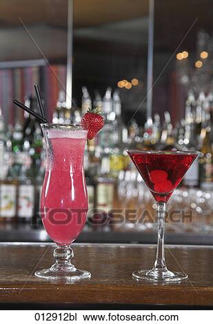 still life of two red coloured cocktails View Large Photo Image Stock Image - still life of two red coloured cocktails . Fotosearch