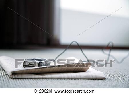 still life with cellphone lying on business paper View Large Photo Image Stock Image - still life with cellphone lying on business paper. Fotosearch