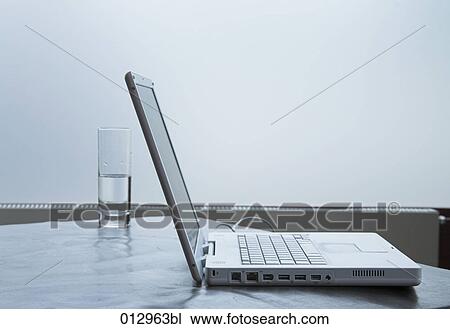 still life with glass of water and notebook View Large Photo Image Stock Image - still life with glass of water and notebook. Fotosearch