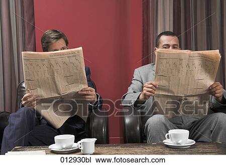 two businessmen reading financial papers View Large Photo Image Stock Image - two businessmen reading financial papers. Fotosearch