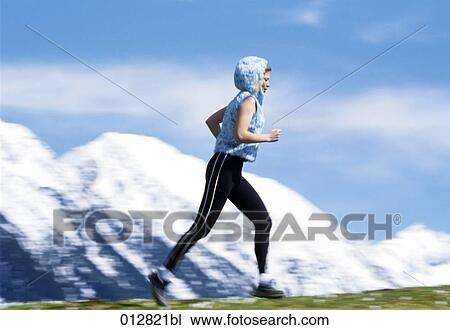 woman jogging in mountain landscape View Large Photo Image Stock Image - woman jogging in mountain landscape . Fotosearch