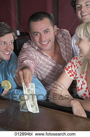 young man paying for his friends at bar View Large Photo Image Stock Image - young man paying for his friends at bar. Fotosearch