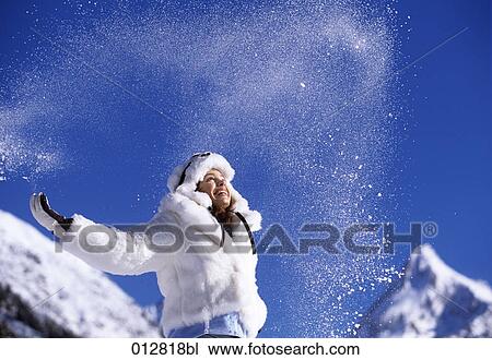 young woman in winter outfit having fun in winter landscape View Large Photo Image Stock Image - young woman in winter outfit having fun in winter landscape. Fotosearch